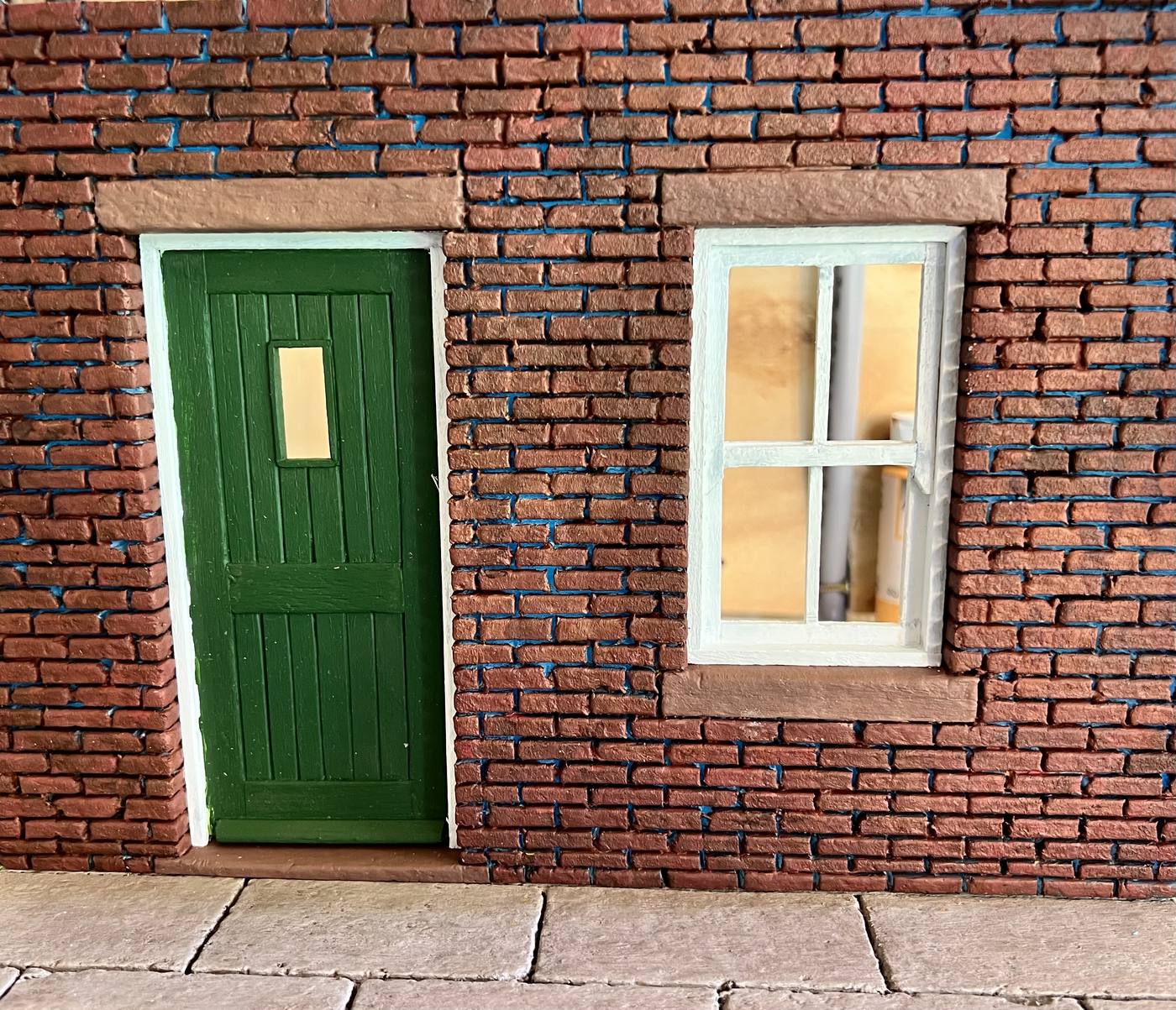 Miniature model of a brick doorway and window