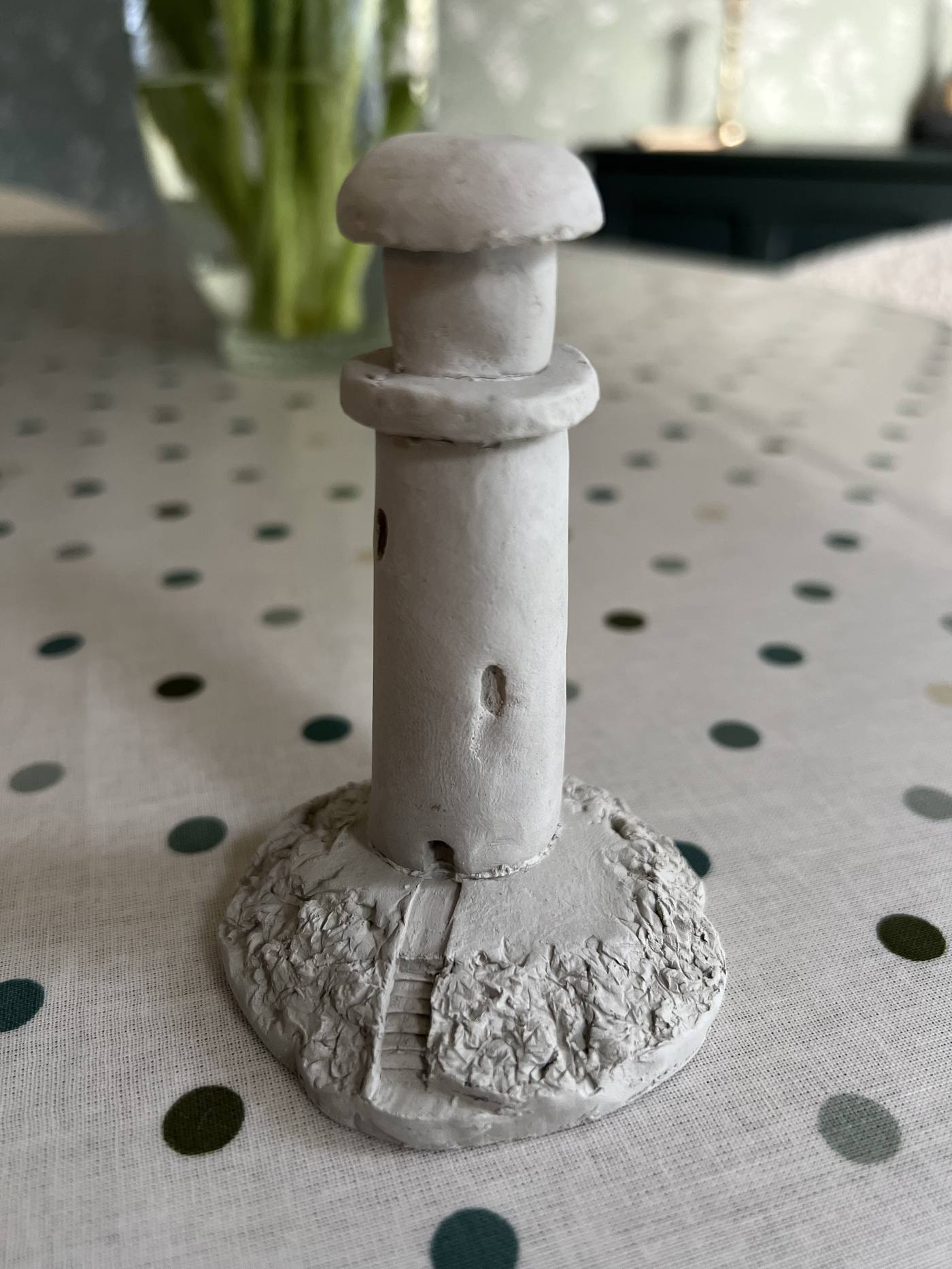 Sculpted clay lighthouse figure
