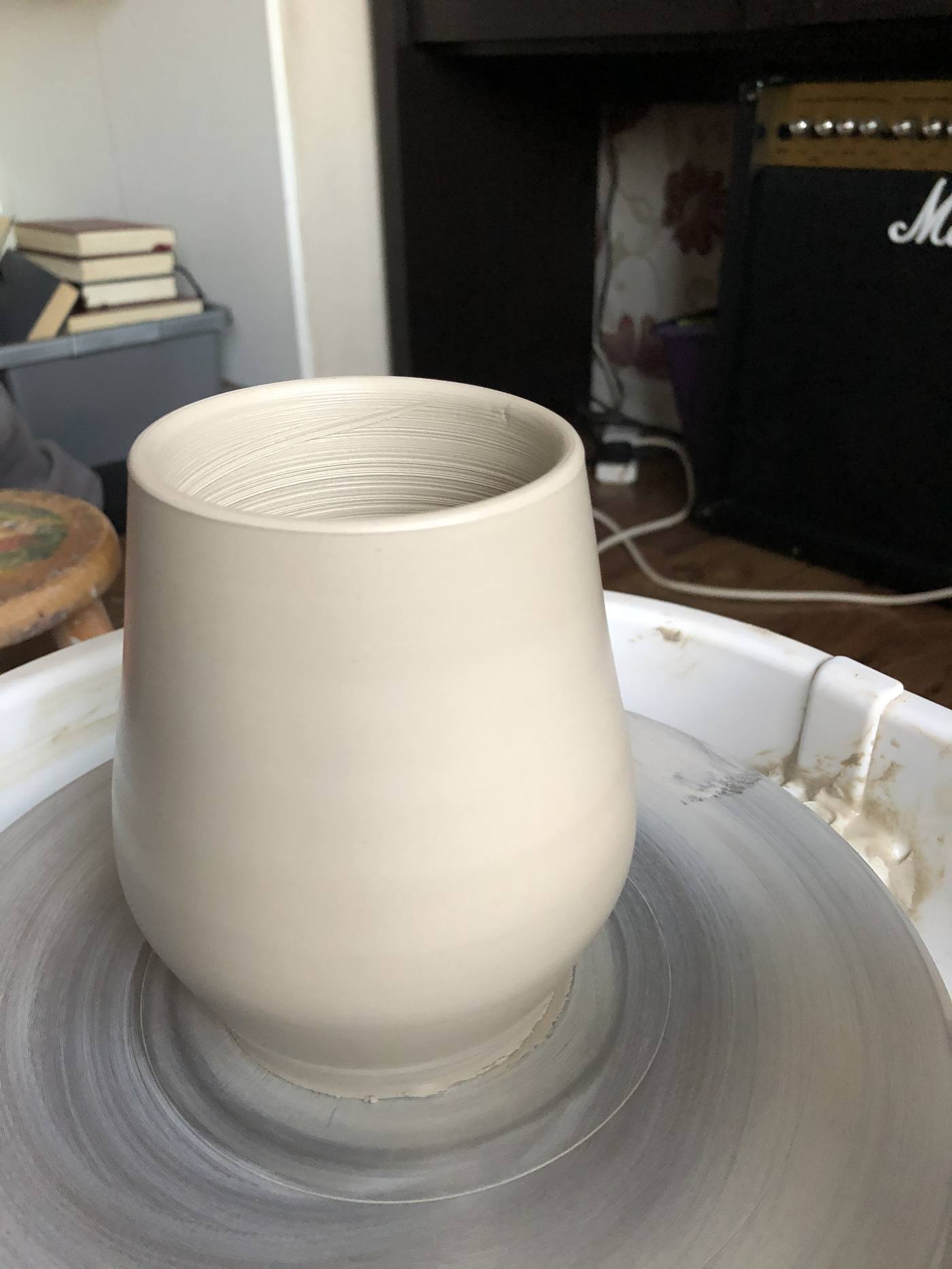 Tapered cup on the pottery wheel